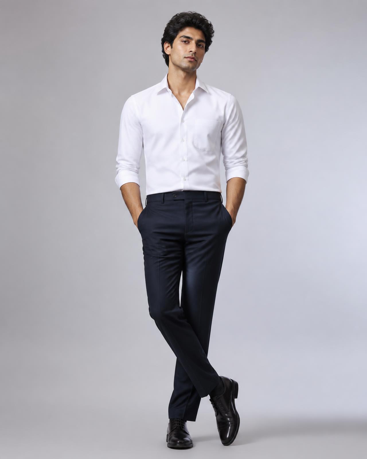 Man wearing a crisp white YJS shirt and tailored trousers